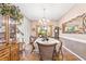 Dining room with hardwood floors, a chandelier, and view into the foyer at 1296 Foxtail Dr., Longs, SC 29568