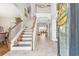 Welcoming foyer features a staircase with seasonal decorations, and hardwood style flooring at 1296 Foxtail Dr., Longs, SC 29568