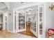 Open entryway to a living room with hardwood floors and french doors at 1296 Foxtail Dr., Longs, SC 29568