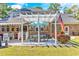 Outdoor patio featuring a pergola, dining set, a grill, and an American flag at 1296 Foxtail Dr., Longs, SC 29568