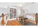 Upstairs play room area with built in shelves, a desk, and a black and white rug at 1296 Foxtail Dr., Longs, SC 29568