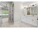 Bathroom featuring double sinks, marble floors, and a glass enclosed shower at 205 Waterfall Circle, Little River, SC 29566