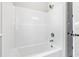 Clean and simple bathroom features an all white tub and shower combo and updated fixtures at 205 Waterfall Circle, Little River, SC 29566