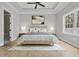 Nicely staged bedroom with a neutral palette, artwork and an ensuite bathroom at 205 Waterfall Circle, Little River, SC 29566