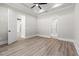 Spacious bedroom features a tray ceiling, hardwood floors and multiple doorways at 205 Waterfall Circle, Little River, SC 29566