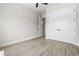 Bedroom features large closet doors, light wood floors, and a ceiling fan at 205 Waterfall Circle, Little River, SC 29566