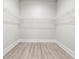 Empty walk-in closet with hardwood floors and wire shelving at 205 Waterfall Circle, Little River, SC 29566