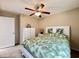 Bedroom featuring a ceiling fan, a palm-leaf comforter, and a white dresser at 209 Foxpath Loop, Myrtle Beach, SC 29588