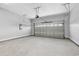 Spacious garage with a clean, neutral color, featuring an automatic door, high ceilings, and ample space at 297 Waterfall Circle, Little River, SC 29566