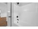Modern white bathtub with black fixtures, showcasing a clean and contemporary design at 309 Waterfall Circle, Little River, SC 29566