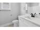 Bright bathroom featuring a white vanity with a white countertop and modern fixtures at 309 Waterfall Circle, Little River, SC 29566