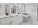 Luxurious bathroom with double sinks, a soaking tub, and modern fixtures at 309 Waterfall Circle, Little River, SC 29566