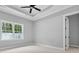 Bedroom featuring neutral colored carpet and paint and a fan above at 309 Waterfall Circle, Little River, SC 29566