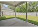 Covered outdoor patio offering an open-air view of the private backyard and landscape at 309 Waterfall Circle, Little River, SC 29566