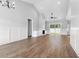 Open floor plan living room with a vaulted ceiling, fan, and sliding glass doors at 309 Waterfall Circle, Little River, SC 29566