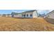 Back exterior of new home showing covered porch and lawn at 329 Palmetto Sand Loop, Conway, SC 29527