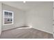 This bedroom has neutral carpet and a bright window at 329 Palmetto Sand Loop, Conway, SC 29527