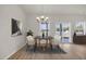 Inviting dining area with contemporary chandelier and natural light at 329 Palmetto Sand Loop, Conway, SC 29527