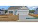 Inviting light blue front door with white trim and a welcoming porch area at 329 Palmetto Sand Loop, Conway, SC 29527