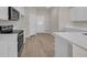 Kitchen featuring stainless steel appliances, quartz countertops, and wood flooring at 329 Palmetto Sand Loop, Conway, SC 29527