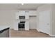 Kitchen with modern stainless steel appliances, white cabinets, and wood floors at 329 Palmetto Sand Loop, Conway, SC 29527