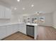 Open concept kitchen and living area with stainless steel appliances and island seating at 329 Palmetto Sand Loop, Conway, SC 29527