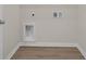 This laundry room has wood look floors and washer/dryer hookups at 329 Palmetto Sand Loop, Conway, SC 29527