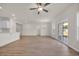 Bright living room boasts wood floors, ceiling fan, and sliding glass doors to the outdoors at 329 Palmetto Sand Loop, Conway, SC 29527