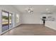 Open-concept living space featuring wood floors and a modern kitchen at 329 Palmetto Sand Loop, Conway, SC 29527