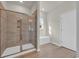 Elegant walk-in shower features modern tile work, a glass door, and a built-in shower bench at 329 Palmetto Sand Loop, Conway, SC 29527