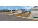 Residential street featuring modern single Gathering homes with well-kept lawns and landscaping at 329 Palmetto Sand Loop, Conway, SC 29527