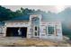 New home under construction featuring Infinity HomeGuard wrap and visible framing, showcasing modern building techniques at 329 Waterfall Circle, Little River, SC 29566