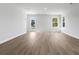 Open living space with light vinyl flooring and windows showcasing natural light and outdoor views at 1061 Kinness Dr., Conway, SC 29527
