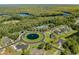 Aerial view of neighborhood with large pool, community center, and lush landscaping at 372 Chamberlin Rd., Myrtle Beach, SC 29588