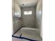 Bathroom under construction with new tile and a built-in bench in the shower at 372 Chamberlin Rd., Myrtle Beach, SC 29588