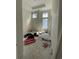 Unfinished bedroom with two windows, new trim, and tile flooring at 372 Chamberlin Rd., Myrtle Beach, SC 29588