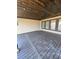Covered porch with dark wooden planks and view of adjacent yard, perfect for relaxing outside at 372 Chamberlin Rd., Myrtle Beach, SC 29588