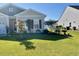 Charming home with a lush green lawn, manicured landscaping, and curb appeal at 408 Stevia Ct., Conway, SC 29526