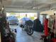 Spacious garage with a GMC truck, covered cars, and organized storage at 408 Stevia Ct., Conway, SC 29526