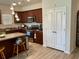 Well-equipped kitchen with stainless steel appliances and dark wood cabinets, including a kitchen island at 408 Stevia Ct., Conway, SC 29526