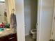 Compact powder room features granite counters, and a toilet room for added privacy at 408 Stevia Ct., Conway, SC 29526