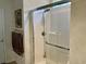 Clean and modern shower with sliding glass doors, a shower head, and convenient storage at 408 Stevia Ct., Conway, SC 29526