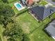 An aerial view shows the home with a large backyard and a fenced-in yard, perfect for outdoor activities at 9048 Abingdon Dr., Myrtle Beach, SC 29579