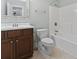 Well-lit bathroom featuring a shower-tub combo, a toilet, and a vanity with a framed mirror at 9048 Abingdon Dr., Myrtle Beach, SC 29579