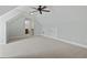 Bonus room with plush carpeting, neutral walls, and a ceiling fan, offering a flexible living space at 9048 Abingdon Dr., Myrtle Beach, SC 29579