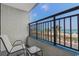 Balcony with chairs offering stunning ocean views and a glimpse of the sandy beach at 1501 S Ocean Blvd. # 240, Myrtle Beach, SC 29577