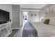Well-lit bedroom with view to the kitchen and balcony, plus TV on console at 1501 S Ocean Blvd. # 240, Myrtle Beach, SC 29577