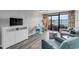 Living room showcasing beach views, stylish decor, and comfortable seating, with a modern entertainment center at 1501 S Ocean Blvd. # 240, Myrtle Beach, SC 29577