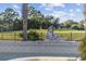 An outdoor statue sits near a palm tree with views of the golf course at 1549 Serena Dr., Myrtle Beach, SC 29579