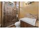 Elegant bathroom features a glass enclosed shower with decorative tile and custom vanity at 1549 Serena Dr., Myrtle Beach, SC 29579